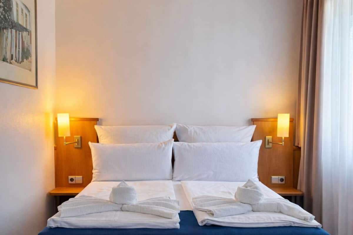 Hypo-allergenic bedding, in-room safe, desk, laptop workspace