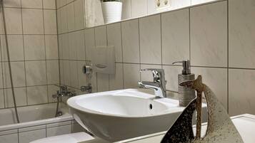 Hair dryer, towels, soap, toilet paper