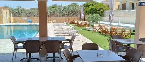 Seasonal outdoor pool, open 9:00 AM to 9:00 PM, sun loungers