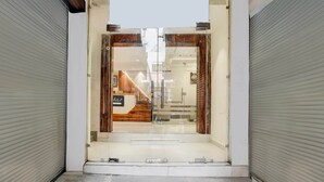 A storefront with a large glass door, a wooden interior, and a sign that reads "Collection." - Super Collection O Dehradun Central (Dehradun)