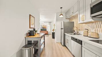 Coffee/tea maker, fridge, microwave, oven