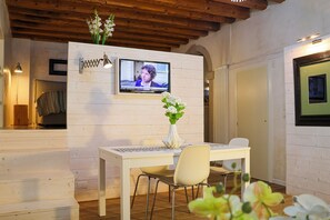 Studio, 1 King Bed, Non Smoking | Living area | Flat-screen TV