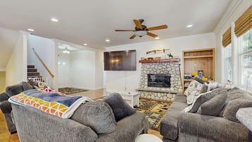 TV, fireplace, books