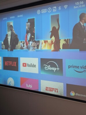 A television screen displaying a variety of streaming service logos, including Netflix, YouTube, Disney+, and Prime Video. - Ponce Pueblo Central Apt (Ponce)