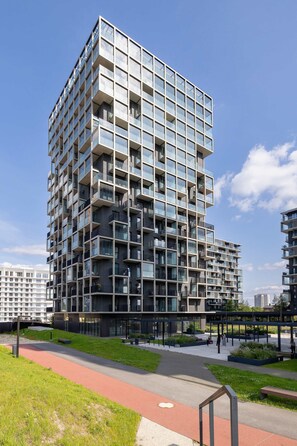 Another modern exterior shot with green walking paths around the residence. - Stylish Apartment | 800 m from Spodek and Balcony (Katowice)