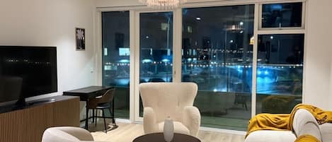 Luxury Apartment, Balcony, Ocean View | Living area | 55-inch Smart TV with satellite channels