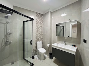 Shower, hair dryer, towels, soap