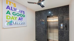 An elevator with a digital display and a phone. - Treebo Sri Krishna Palace (Bhubaneshwar)