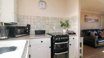 Fridge, microwave, toaster, cookware/dishes/utensils