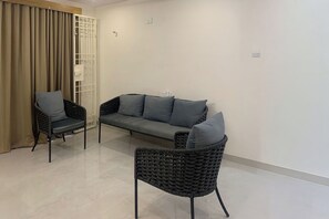 Deluxe Apartment, 3 Bedrooms | Living area | 32-inch LED TV with cable channels - DeVerveil Serviced Apartment (Mysore)