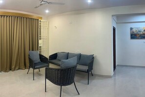 Deluxe Apartment, 3 Bedrooms | Living area | 32-inch LED TV with cable channels - DeVerveil Serviced Apartment (Mysore)