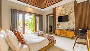 A modern hotel room with a large bed, a wooden ceiling, a flat-screen TV, a wooden dresser, and a view of the outdoors.
