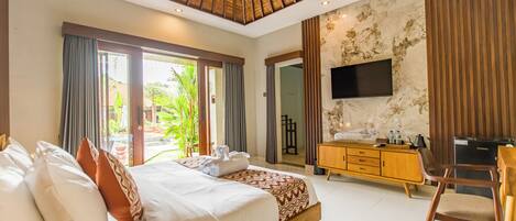 A modern hotel room with a large bed, a wooden ceiling, a flat-screen TV, a wooden dresser, and a view of the outdoors.