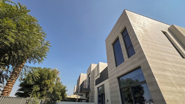 A modern building with large windows and a flat roof. - Resort-Style - 4BR Villa, Arabian Ranches 3 (Dubai)