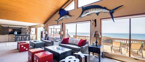 Télévision, cheminée, lecteur de DVD, baby-foot