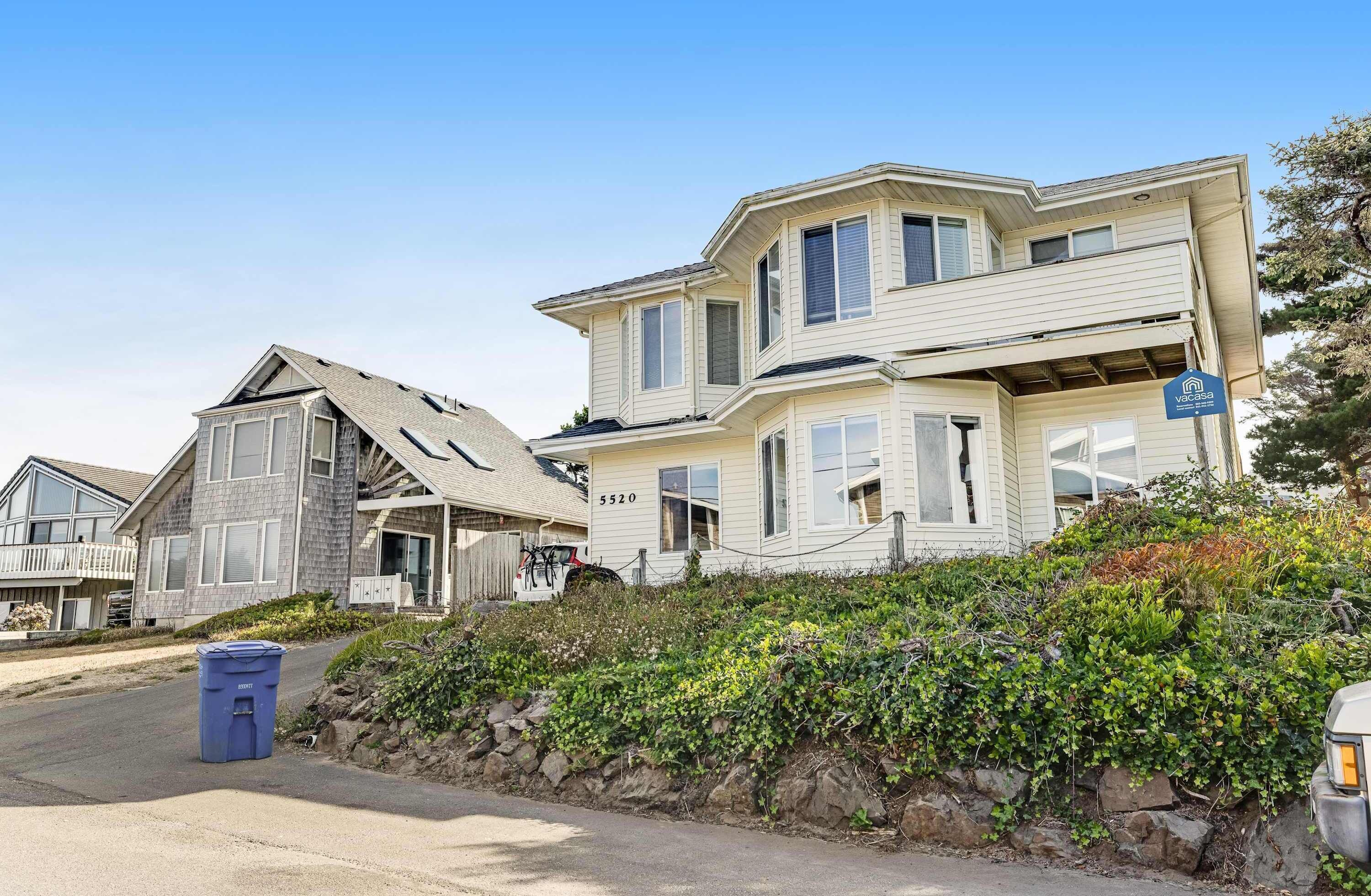 A two-story house with a number 5520 on the front.