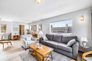 TV, fireplace, offices - Inviting Haven with Large Yard WiFi and Partial Ocean View Steps to Beach (Lincoln City)