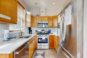 Fridge, microwave, oven, stovetop - Waterfront home with private hot tub free WiFi firepit and shared dock (Lincoln City)