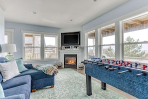 TV, fireplace - Ocean view home with hot tub game room furnished deck and fireplaces (Lincoln City)