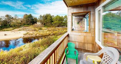 Creekside condo with beach access balcony full kitchen and ocean views