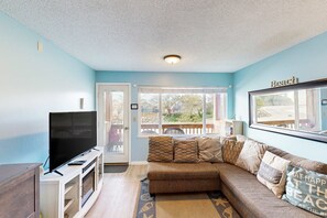 TV, fireplace - Creekside condo with beach access balcony full kitchen and ocean views (Neskowin)