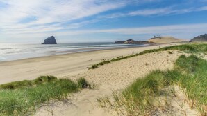 A beach with sand dunes and grassy areas. - Spacious Dog Friendly Getaway with Boat Parking Perfect for Two Families (Pacific City)