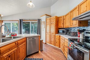 Fridge, microwave, oven, stovetop - Cozy Home with Wood Stove WiFi Gas Grill and Large Deck Walk to Beach (Pacific City)