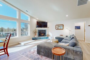 TV, fireplace, table football - Everything Remodeled Water View Private Hot Tub WiFi Game Room (Pacific City)