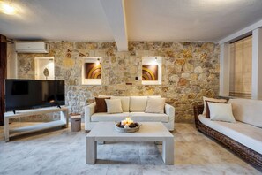 Anemos Villa with Private Pool | Living area | 42-inch Smart TV with satellite channels - Palmrise Luxury Villas (Kassandra)