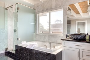 Shower, hair dryer, towels, shampoo