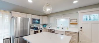 Renovated dog friendly cottage with a covered porch deck yard and washer dryer