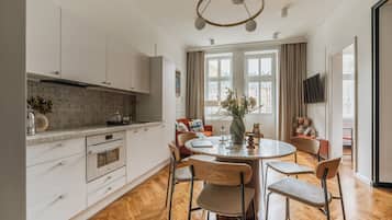 Family Apartment, Balcony, City View | In-room dining