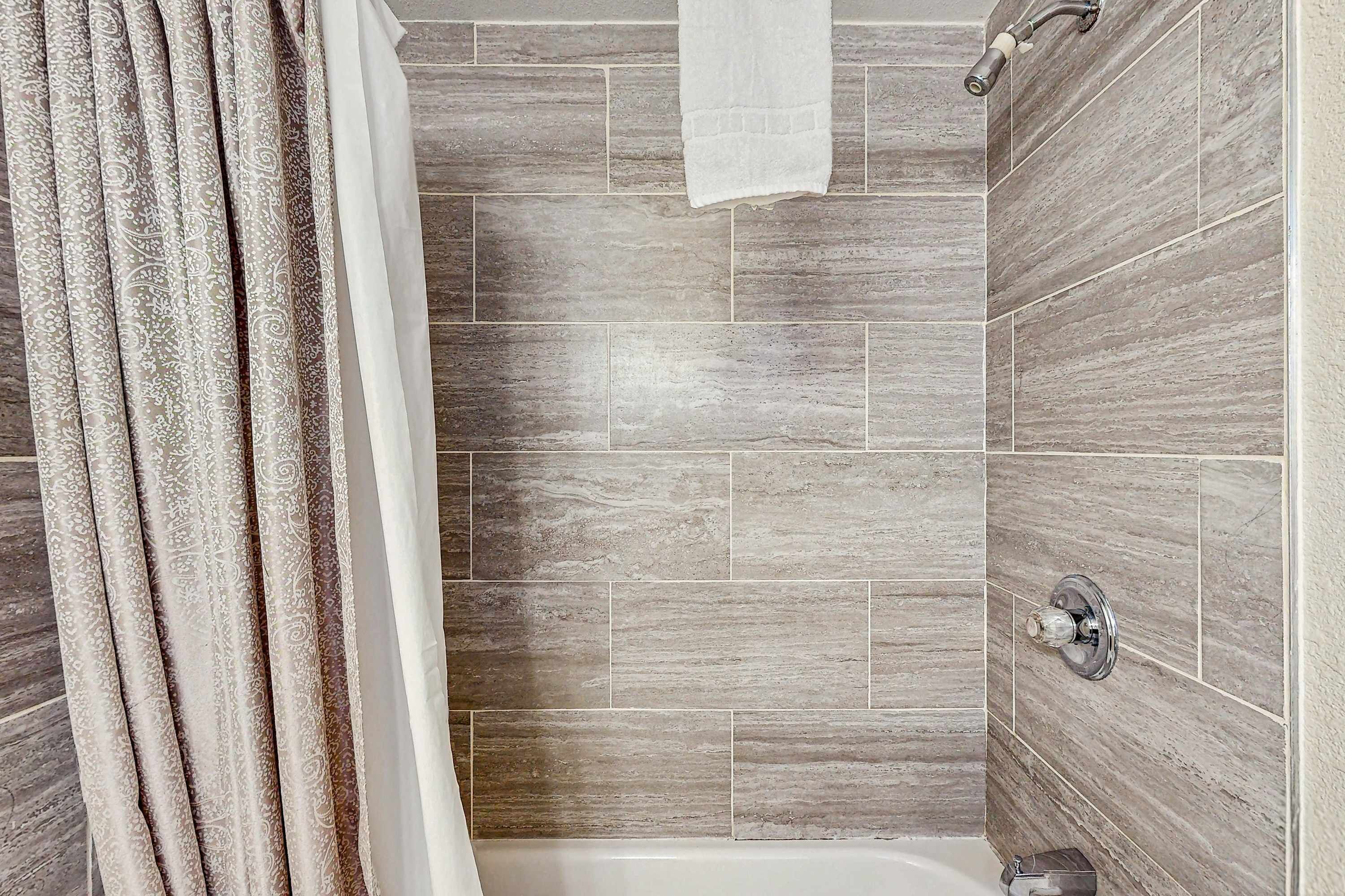 Shower, hair dryer, towels, shampoo