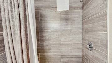 Shower, hair dryer, towels, shampoo