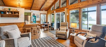 Rustic waterfront woodland lodge with impressive lake views from patio