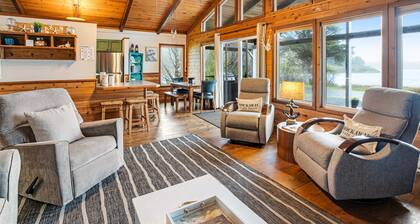 Rustic waterfront woodland lodge with impressive lake views from patio