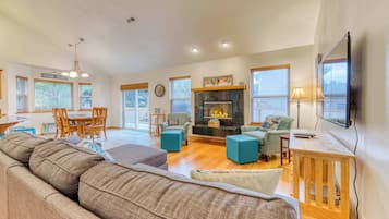 Télévision, cheminée, lecteur de DVD, espaces bureaux