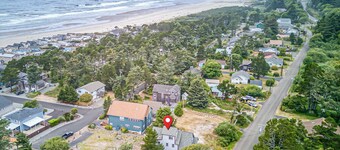 Spacious coastal retreat | 3-min walk to beach | Decks & mountain views