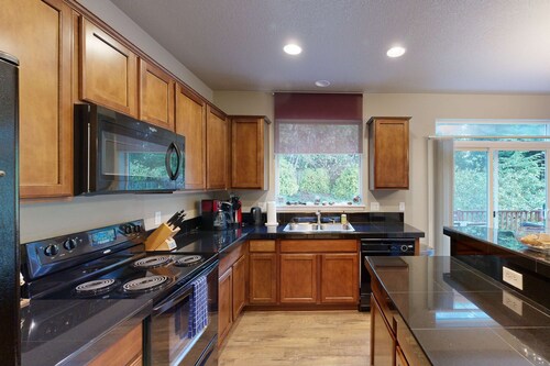 Modern Ocean Highlands home with Netarts Bay and ocean views fireplace dogs OK