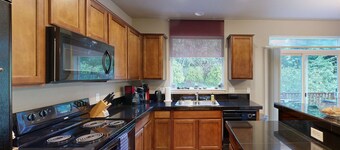 Modern Ocean Highlands home with Netarts Bay and ocean views fireplace dogs OK