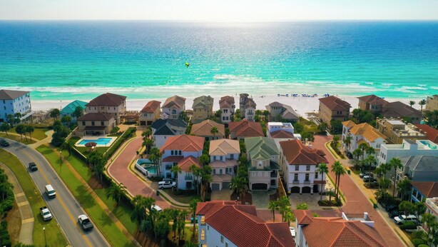 A coastal residential area with houses, a road, and a beach. - Games, Elevator, Ensuites, Pool, Bikes, Elevator (Destin)