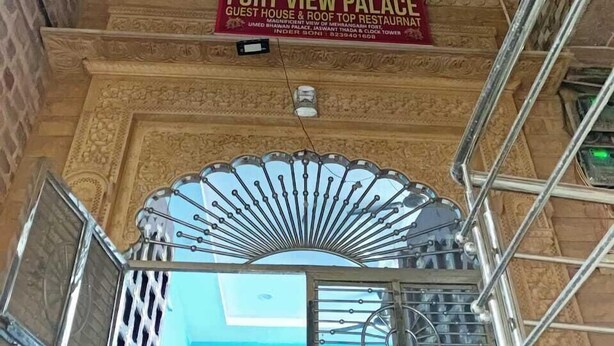 A sign for Fort View Palace, indicating it is a guest house and roof top restaurant. - Fort view palace (Jodhpur)
