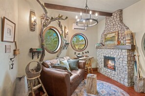 Living area - Woodsman Hobbit with Hot Tub & Fireplace (Fredericksburg)