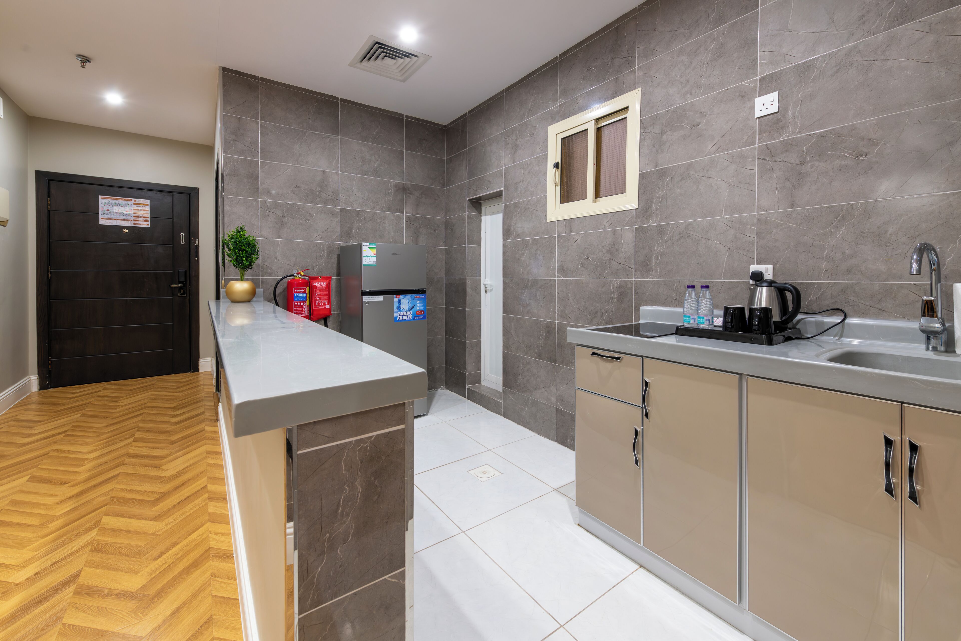 Fridge, coffee/tea maker, cookware/dishes/utensils