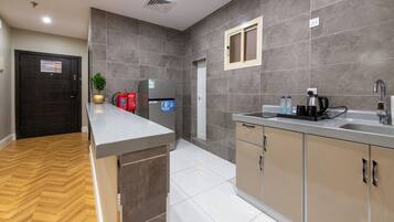 Fridge, coffee/tea maker, cookware/dishes/utensils