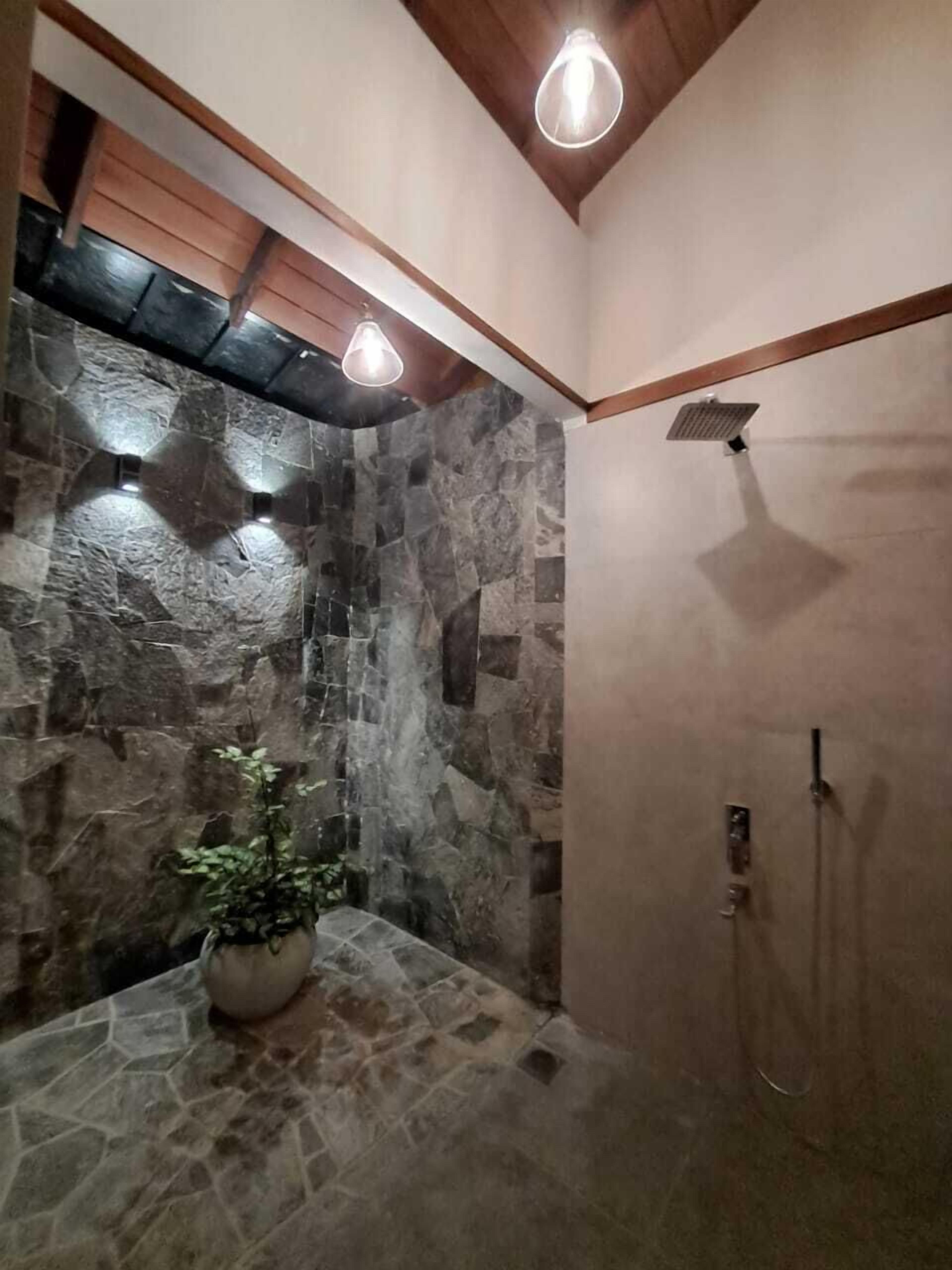 Deluxe Villa, Multiple Beds, Patio, River View | Bathroom | Shower, rainfall showerhead, designer toiletries, hair dryer