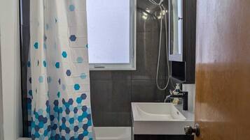 Bidet, towels, soap, toilet paper