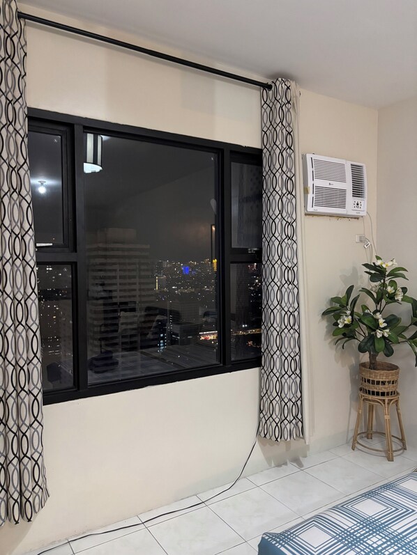 Family Condo, City View | Desk, laptop workspace, free WiFi - Carnivale Inn Staycations (Manila)