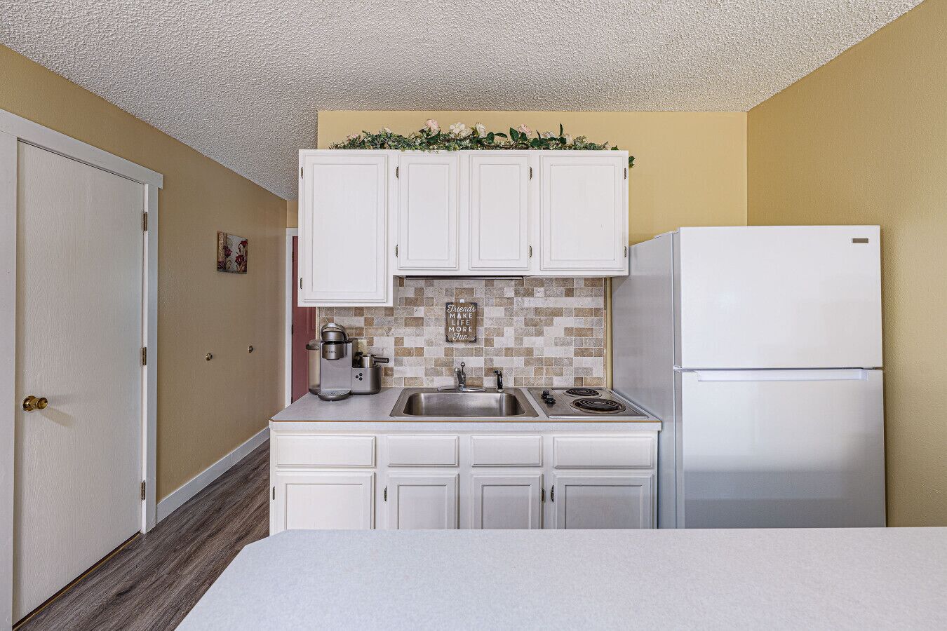 Fridge, microwave, stovetop, coffee/tea maker