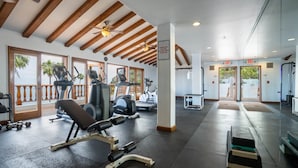 A gym with treadmills, weight machines, and dumbbells. - 13/46 Fully Remodeled - Street level -2bd/2bath with 6 passenger Golf Cart (Avalon)